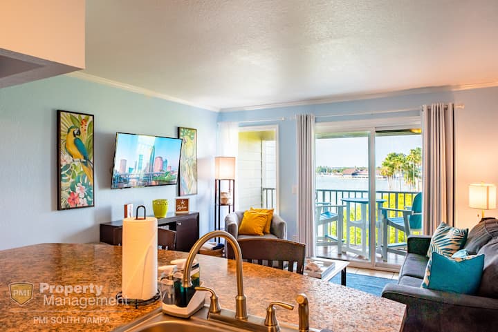 Open concept living area flows from the full kitchen, living area, and onto the private balcony overlooking the preserve and Old Tampa Bay