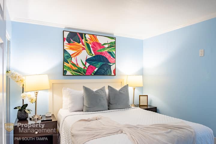 Queen sized bed with beautiful decorations and thoughtful details to make you feel right at home