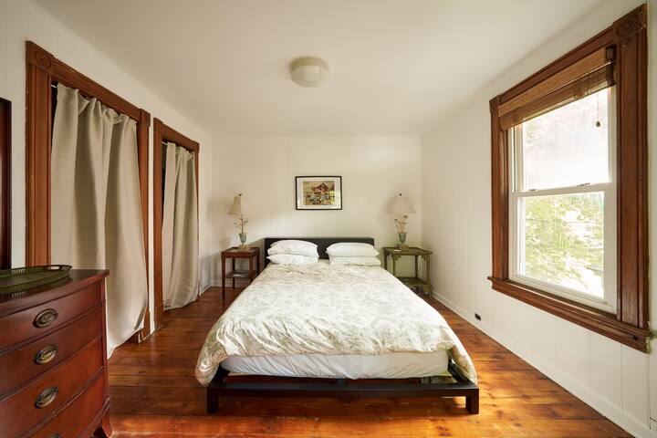 Queen-size bed, full dresser and two closets in bedroom. Luxury linens and plenty of pillows!

