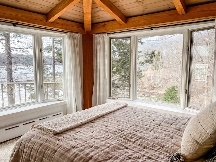 This downstairs bedroom is all almost all windows! This has a more intimate view of our private cove. There is a very comfortable Brentwood memory foam mattress in this room. 