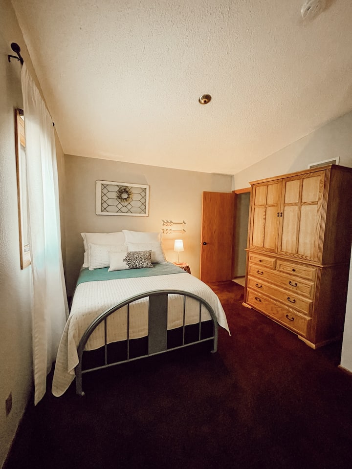 Sunset Room: One queen, one double, spacious room with armoire + closet storage.