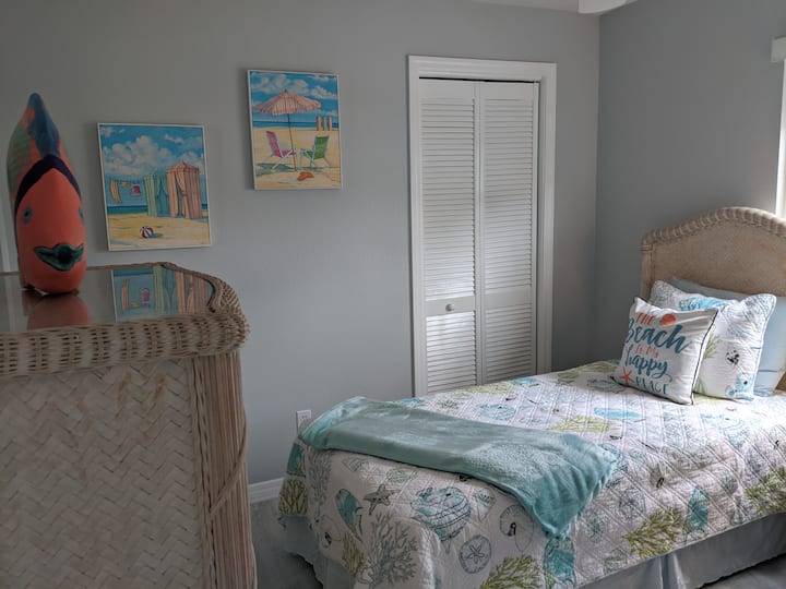 There is a tall dresser to put your clothes away with Mr Fish to greet you!