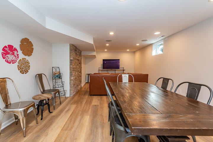 Large downstairs area for hanging out!  Totally renovated. It is a legal bedroom (hence the 4th bedroom) doubling as a TV/bar room, with a full bathroom and laundry room.  