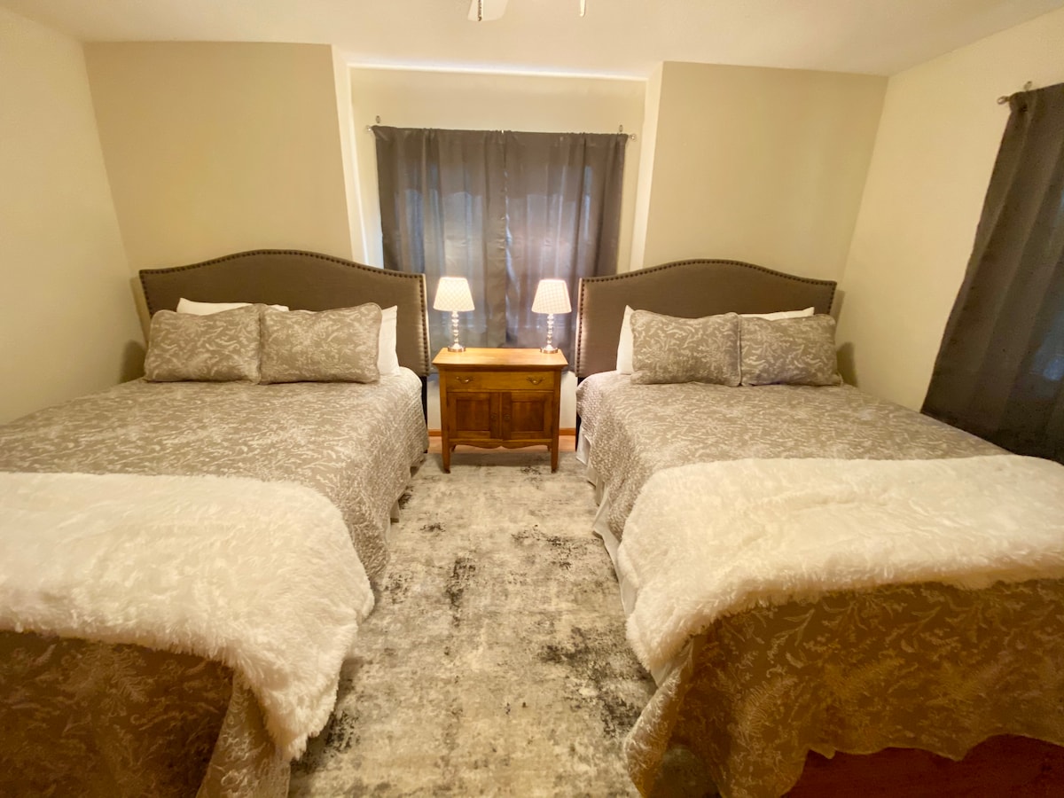 Second main level bedroom with 2 queen beds and two large closets.