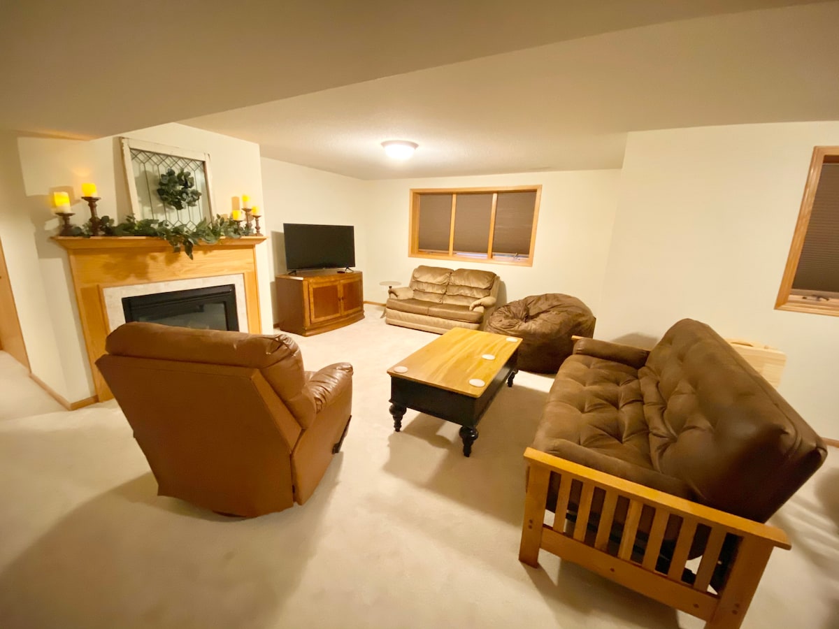 Lower level family room, TV and gas Fireplace.