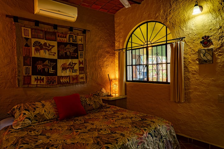 One of the bedrooms. A/C, ceiling fan, rain shower in ensuite bathroom 