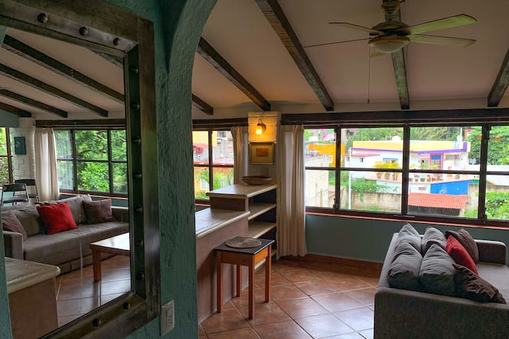 Entering the two bedroom, two bathroom Cielo suite. The wall of windows are openable and little balconies jut out on both sides