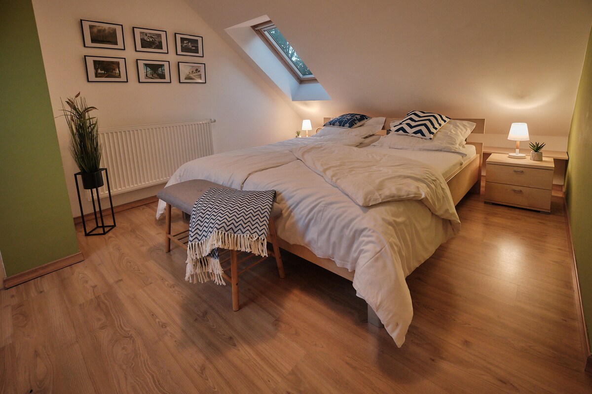 Bedroom 2 is located in the attic. Large velux roof windows with blackout blinds and mosquito repellent. King size double bed (new mattresses in 2022). The small bathroom starts from this bedroom. Stairs is lockable with a stair gate.