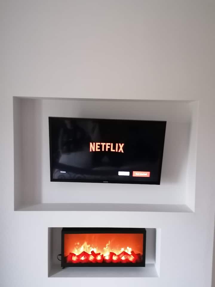 Master Double Bedroom Feature Wall with Faux Fire and Smart TV 