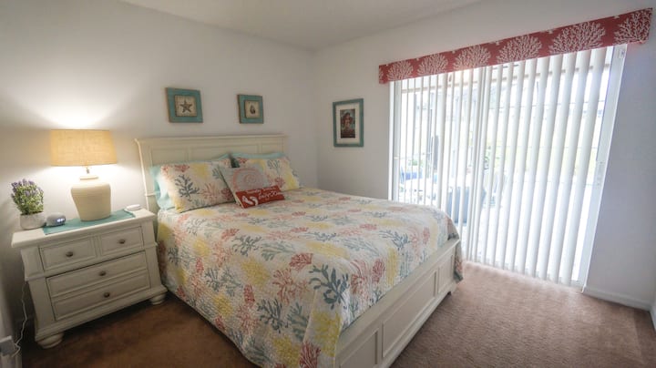 Queen Bedroom (downstairs) with brand new 43" LG UHD smart televisions.  Direct and private access to the pool.  This is the only room not equipped with Alexa enabled lighting.