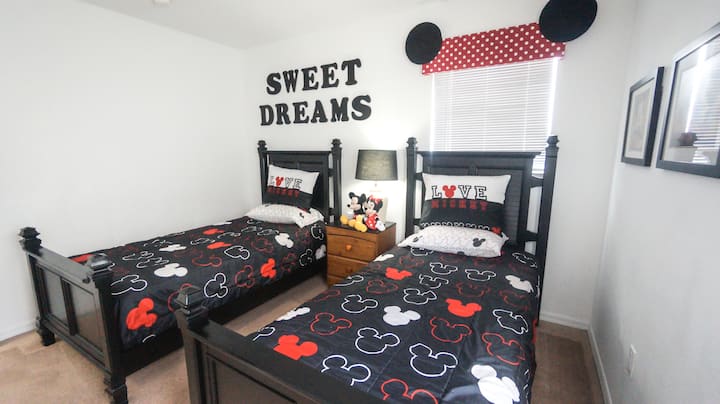 Twin Bedroom with Alexa enabled lighting. Brand new memory foam mattress toppers provided in closet (not placed on the beds due to potential child allergies.  all sheets washed and bleached after each guest stay). USB ports for all electronic devices