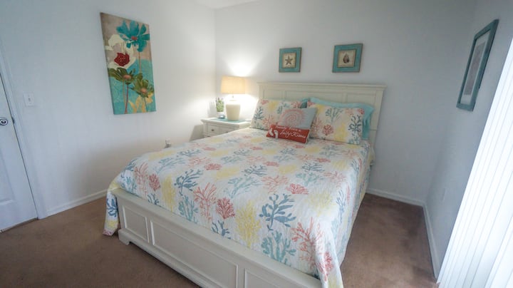 Queen Bedroom (downstairs) with brand new 43" LG UHD smart televisions.  Direct and private access to the pool.  This is the only room not equipped with Alexa enabled lighting.