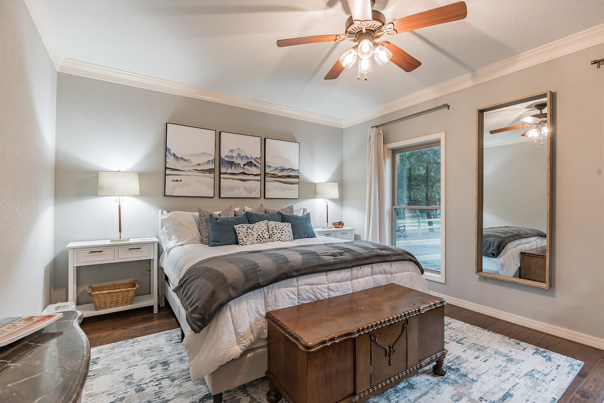 Third Master bedroom downstairs has a king bed with a large screen TV and private bathroom.  Views of the Mt Nebo and deer from the front two windows plus a private closet.This large 3rd master bedroom has everything you need to make your stay ideal
