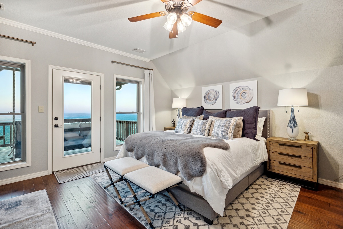 Upstairs main Master bed has a comfortable King bed as well as a pull out twin bed that doubles as a cuddle chair for reading, for any littles. Bedroom also has a Large screen smart TV, private bathroom and large closet with a hanging daybed!