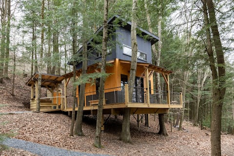 Modern treehouse on working maple syrup farm