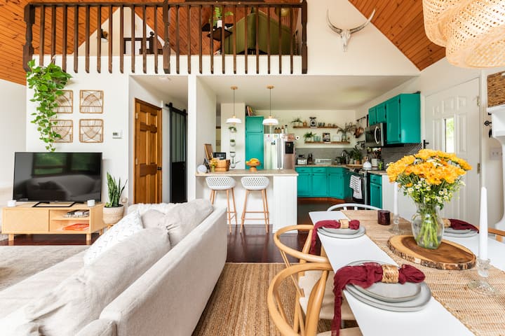 Open plan dining living kitchen main area with wide views of the gardens  and Forrest's 