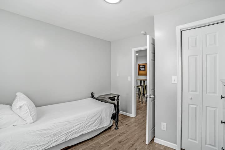Third bedroom with a twin bed and trundle bed.
