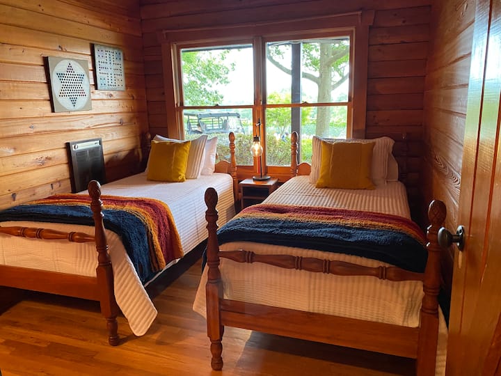 Fun room that embodies cozy cabin living. Great views of the vines.