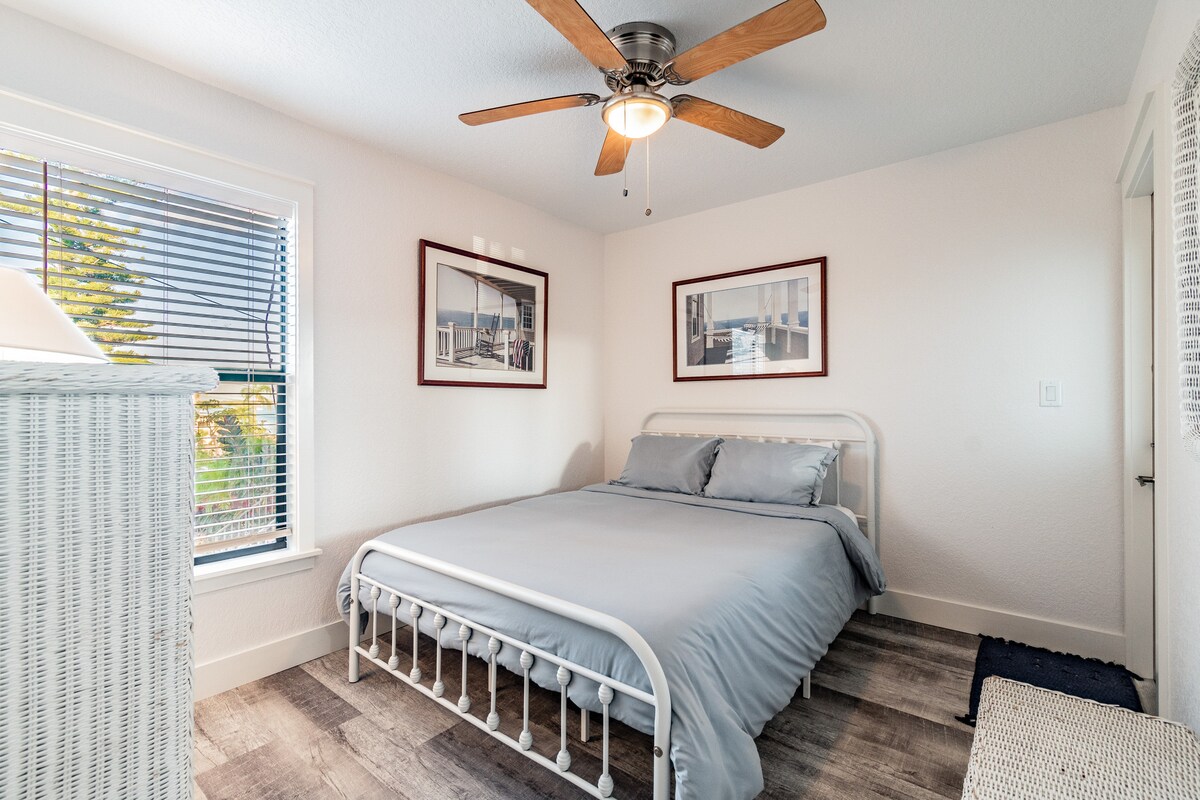 First living level bedroom with queen bed and en suite bathroom!