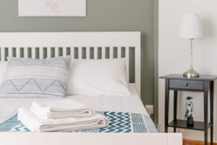 Bedroom with AC unit and storage space.
