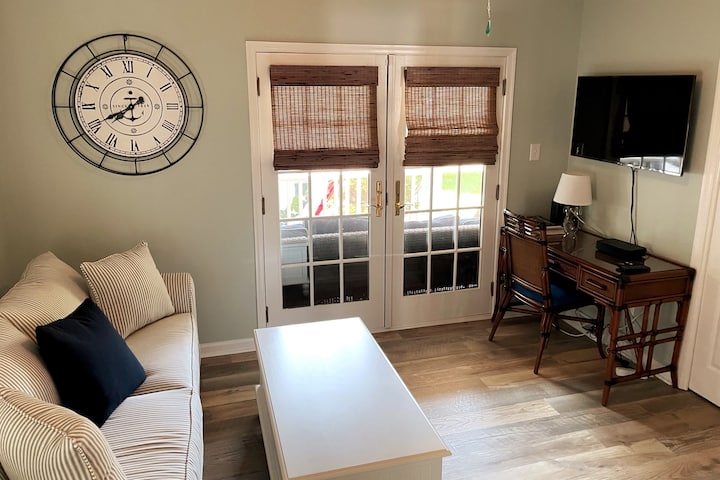 To your right when you walk in the front door is an office/bedroom with a queen bed pullout couch. This room also has a door that leads into the first floor bathroom, which makes it convenient for any family members with mobility issues.