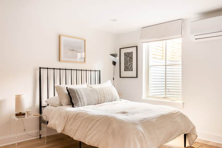 Bed with luxury linens and black out shades