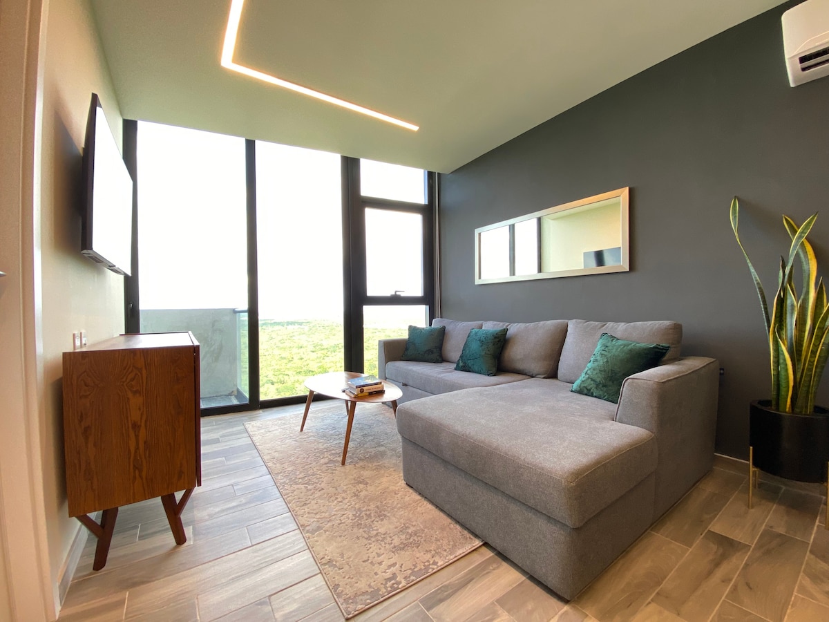 Woonkamer uitgerust met bank/queensize bed 