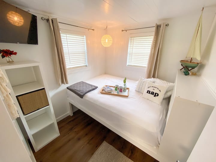 The bedrooms feature a queen bed and 32 inch Smart TV.