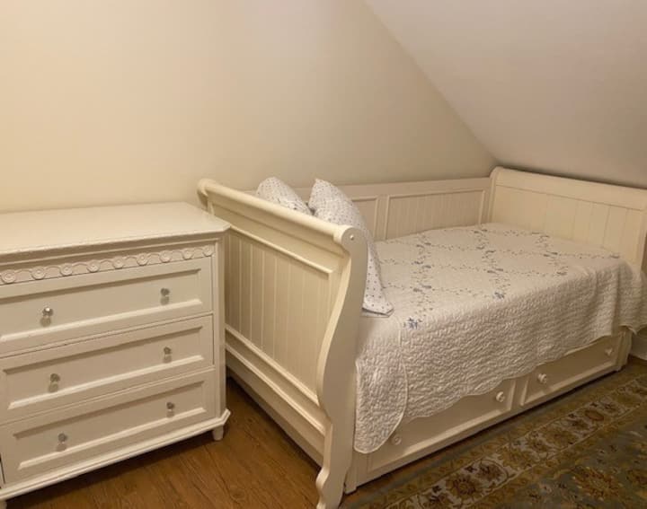 Adorable second bedroom daybed with trundle and matching dresser