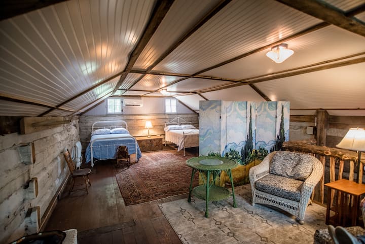 Upstairs loft offers an area with comfy wicker chairs to relax and read or plan tomorrow’s day.