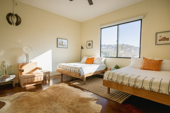 Our dual-queen room sleeps up to 4 guests and has east facing desert views