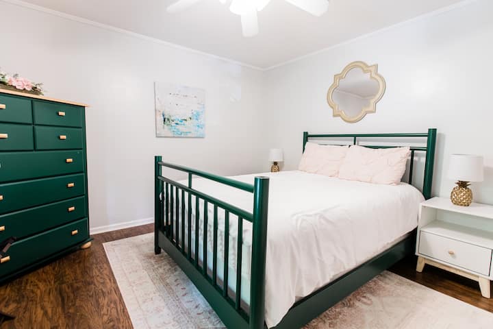 One of two downstairs queen rooms