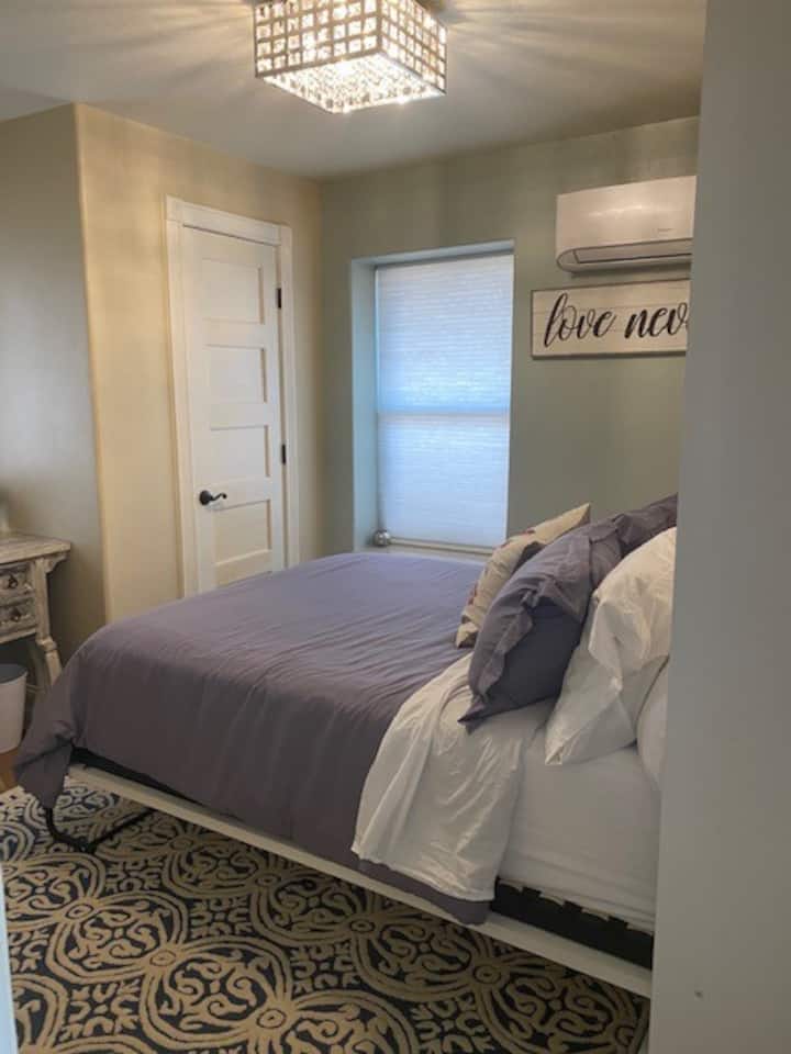 Bedroom with Queen memory foam bed and closet