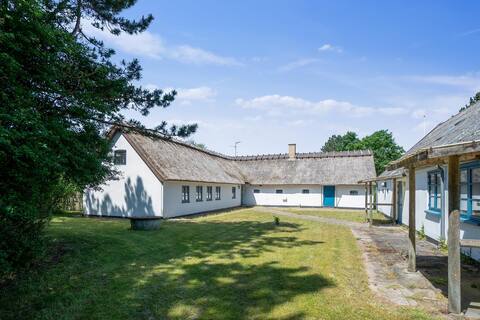 Charming farmhouse sleeps 26 guests.