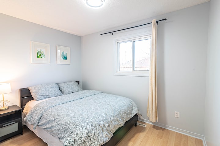 The bedroom 2 with a closet and a night stand