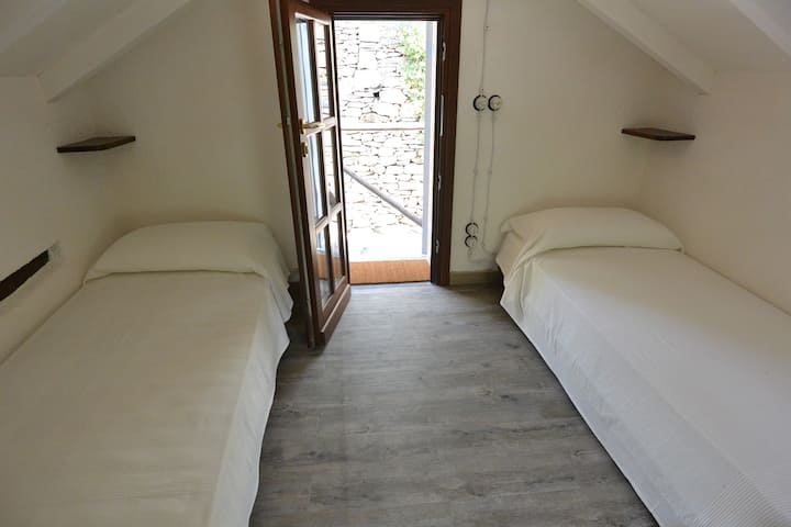 The nice Essicatoio room, a small gem in the old Essicatoio building recently refurbished. It's suitable for 2 kids or 2 'lovers'. The bathroom is just few steps outside the room, small but perfectly equipped with a shower, toilet, and a bidet.