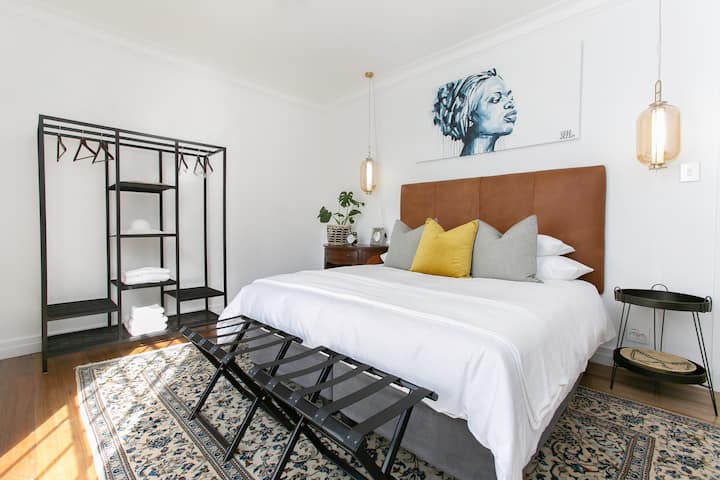 Master bedroom in Historical home, available for self-catering stays. King extra length bed as focal point with overhang artwork adding artistic allure to the room. With period specific furnishings and decor elements that exude old-world charm.