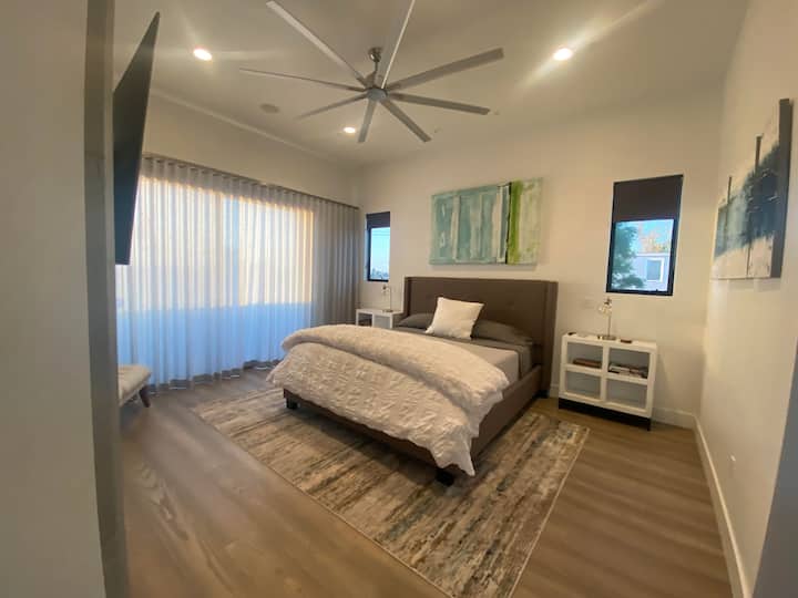 Master Bedroom Suite with access to balcony on main floor.