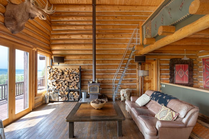 Spacious living room w leather couches, wood stove, and spectacular views 