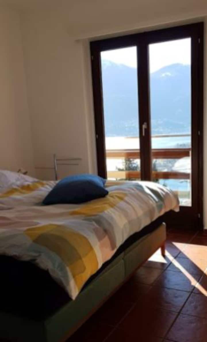 Bedroom with double bed, built-in wardrobe and dresser