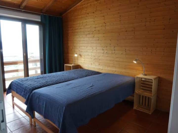 Bedroom with two single beds, wardrobe, frame and desk