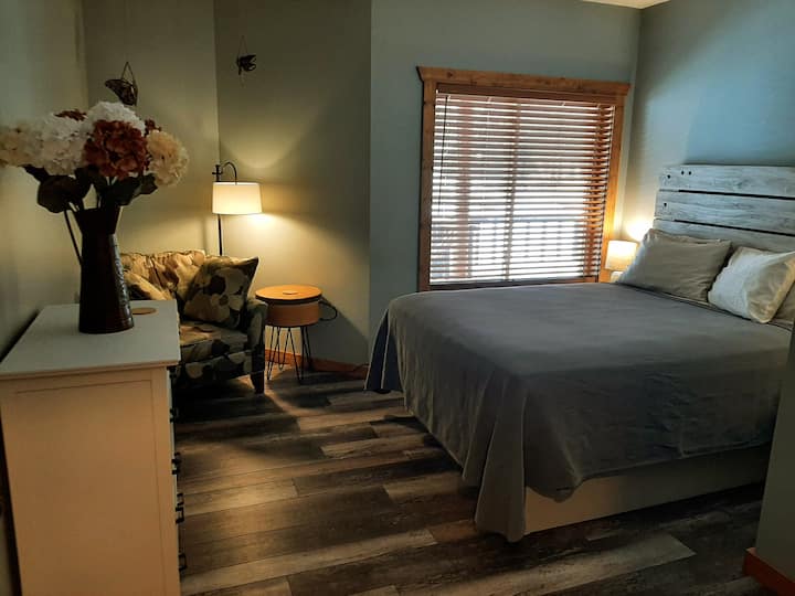 The other queen bedroom is spacious and so inviting.