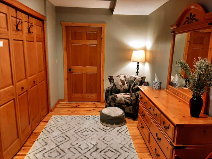 Our master suite is spacious and contains a sitting area,full bath and queen size bed.