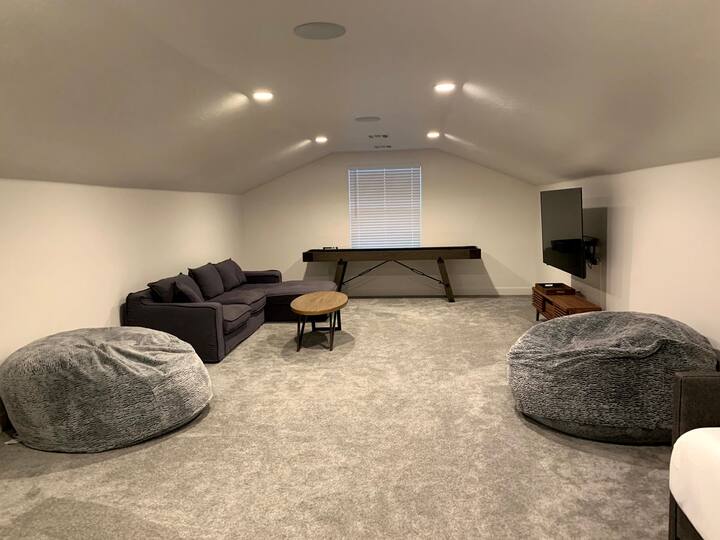 Loft with shuffleboard table and lots of open space