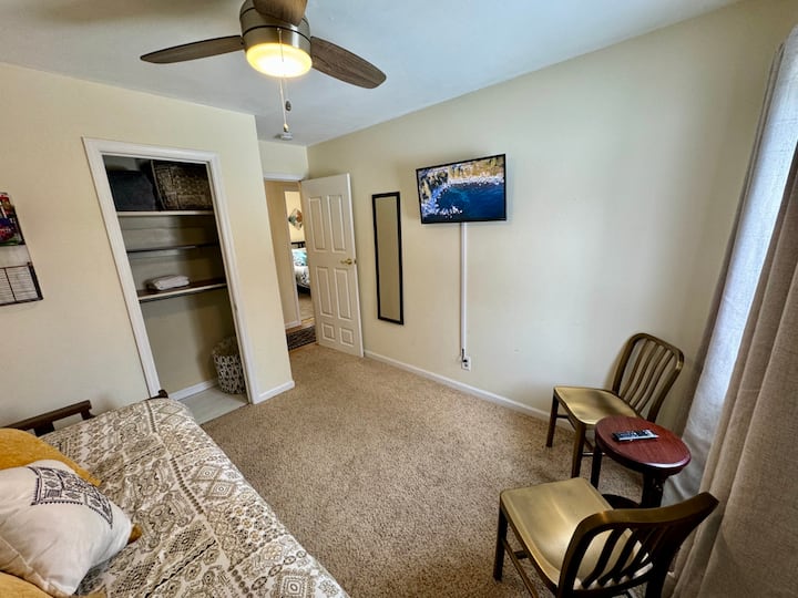 Our twin room features a trundles bed (1 twin and one roll away twin). Seating for two and a 32" smart tv. Stocked with extra bedding, blankets and towels. 