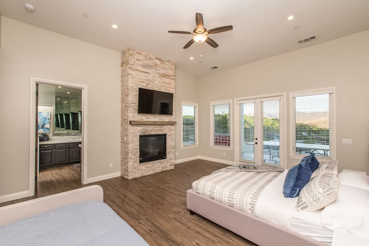 Bedroom #2- 1 King Bed, 2 single beds, with tv.  Fireplace is not operable.  Has Master Bath with tub, Stand up shower, dual vanity, makeup vanity, walk in closet with pack n play.