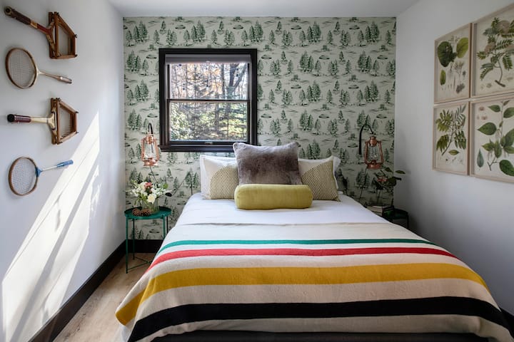 The 'green' bedroom with queen memory-foam mattress and camp-inspired details.  Super soft bedding & pillows will tempt you to lounge in bed all day.