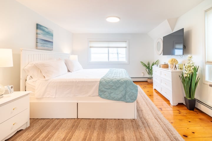 Water view - Master bedroom - king bed  - Smart TV with Premium Cable available. Alarm clock with Bluetooth and USB charging ports. First Aid Kit.