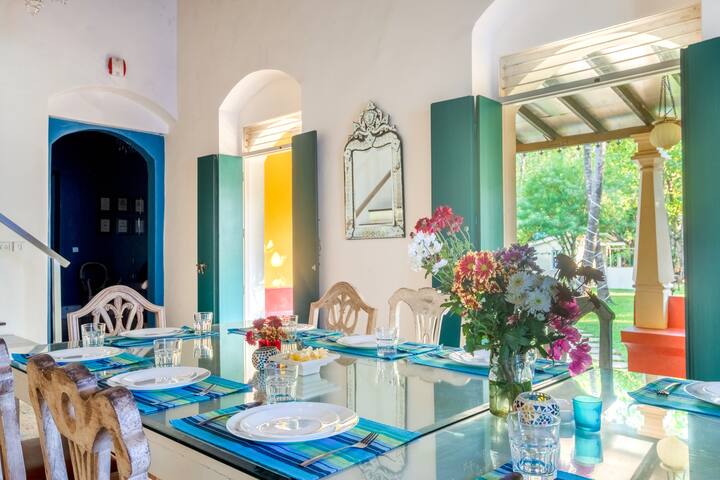 Spacious, open dining room with a 12-14 seater table for the whole gang.