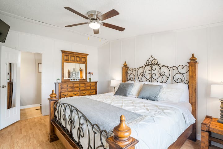 The Master Bedroom has a king size bed with USB beside lamps.